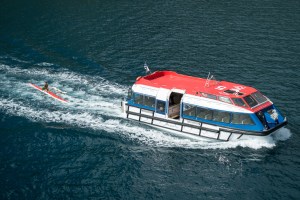 An OC-1 rides the wake of Insignia's tender